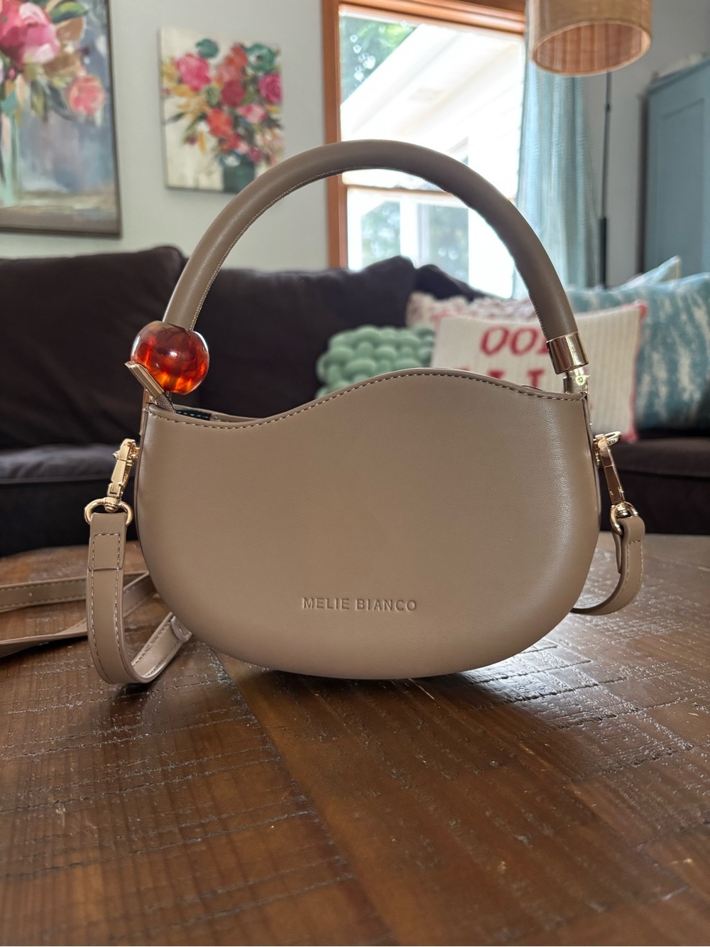 Melie Bianco taupe crescent mini bag with amber accent